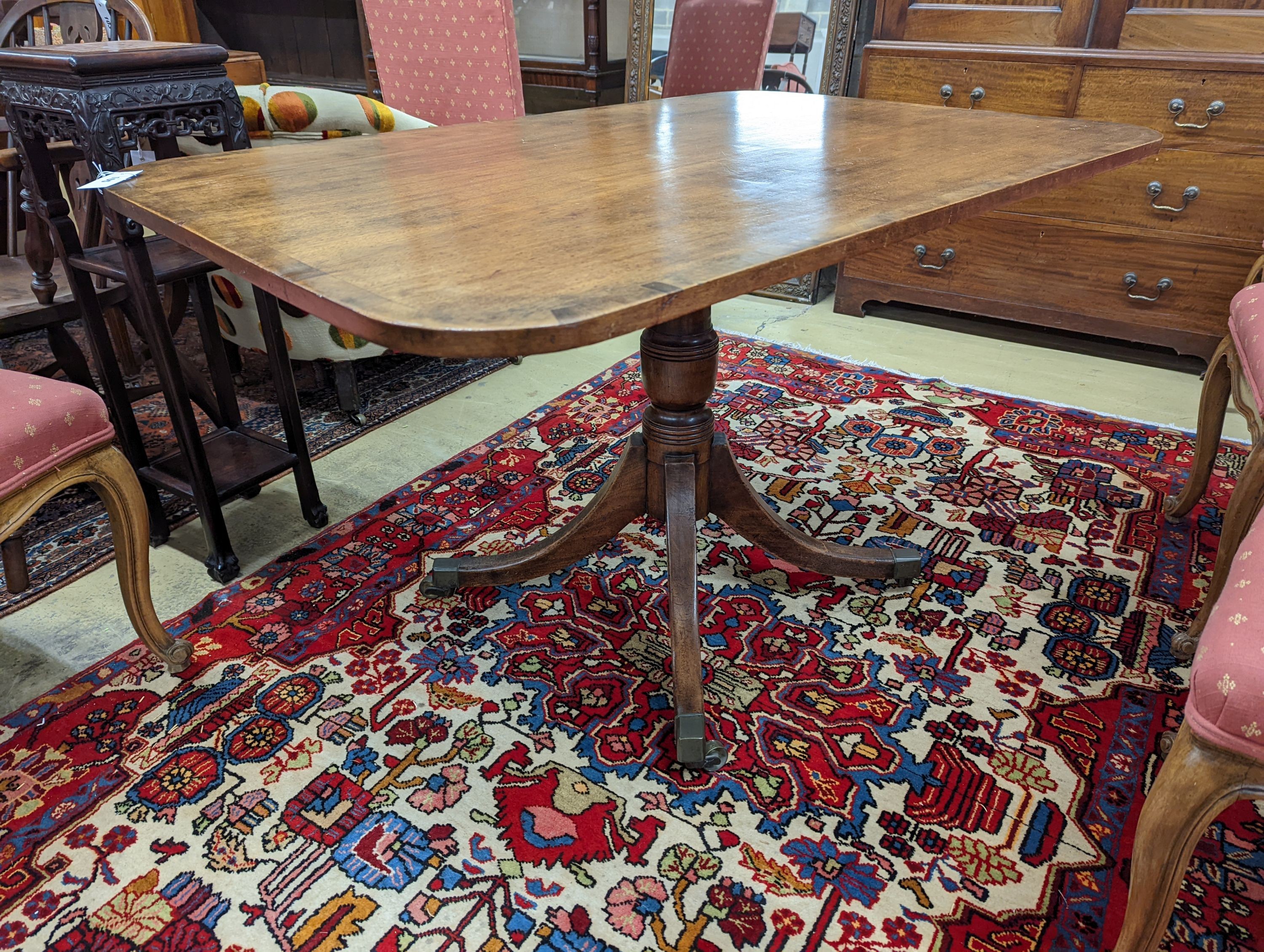 A Regency banded mahogany rectangular tilt top dining table, length 121cm, depth 82cm, height 71cm